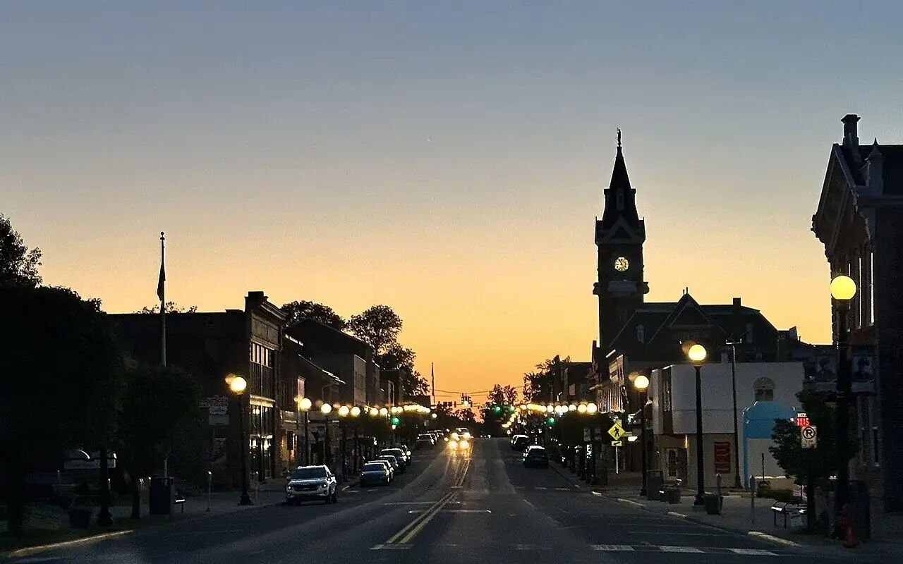 Main Street and the Clarion County Courthouse tower at dusk in Clarion, PA